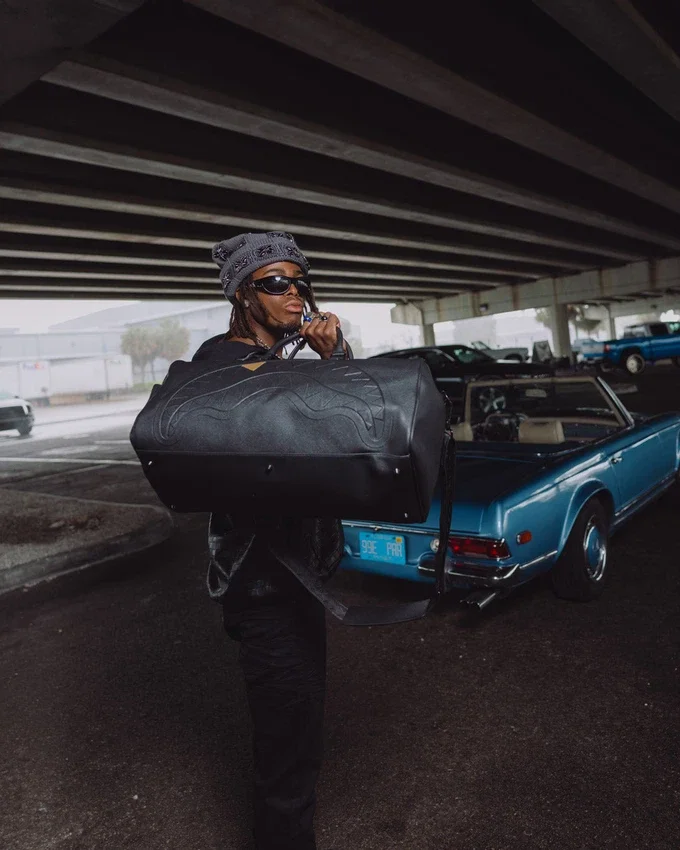 THE GOLDEN FANG SHARK DUFFLE